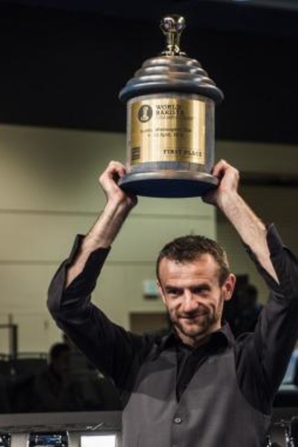 Canberra barista Sasa Sastic raises the trophy