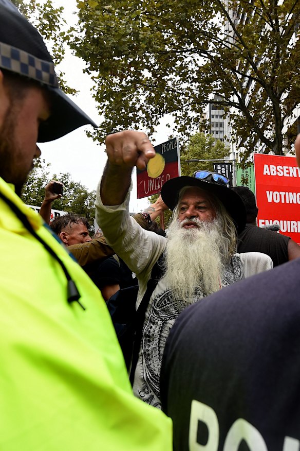 Lyle Davis (centre) during the protest. 
