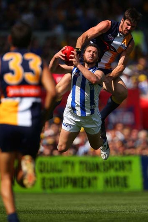 Eagle Quinten Lynch clatters into Scott McMahon.