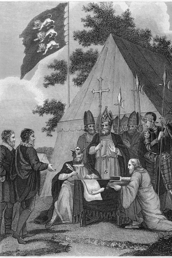 Attended by courtiers and clergymen, King John signs the Magna Carta at Runnymede.
