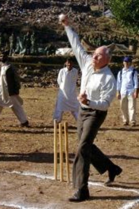 Bowling them over: John Howard in Pakistan in 2005.