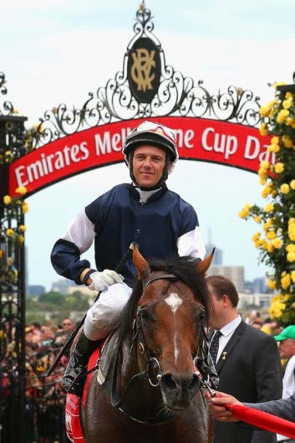 First past the post ... Brett Prebble riding Green Moon celebrates winning the 2012 Melbourne Cup.