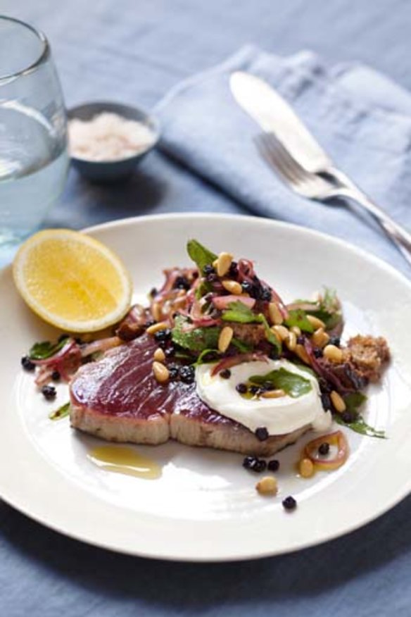 Seared tuna steak with pine nuts, currants, sorrel and mint.