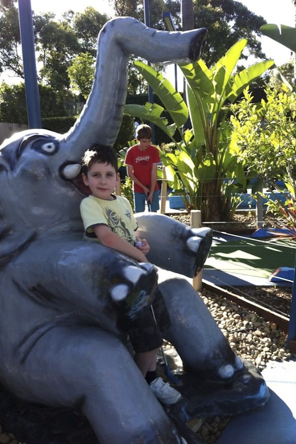 Family day out: A local boy takes a breather on the Jungle Trail at Ermington Putt Putt.