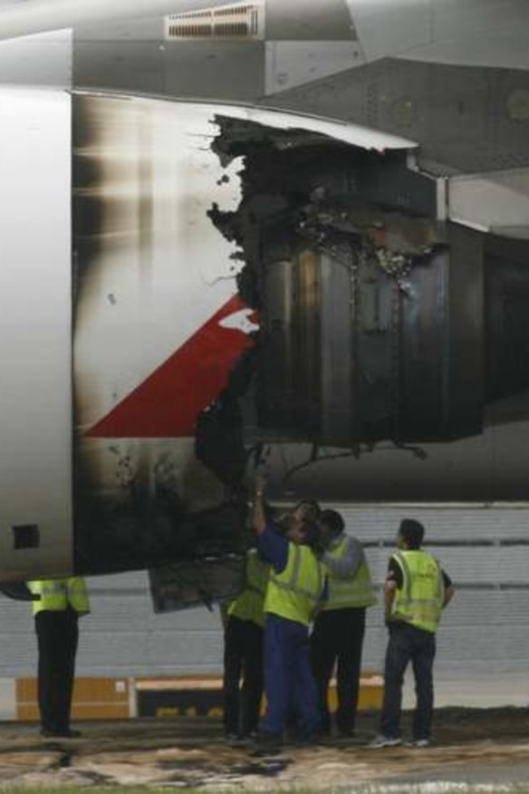 Technicians inspect the damaged engine on QF32 in 2010.