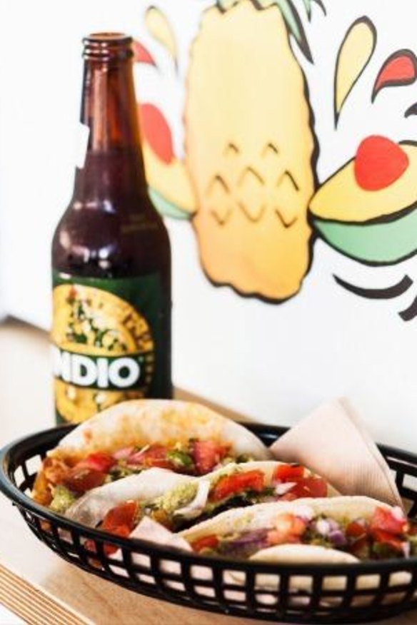 Tacos and Mexican beer at colourful Kikiriki.