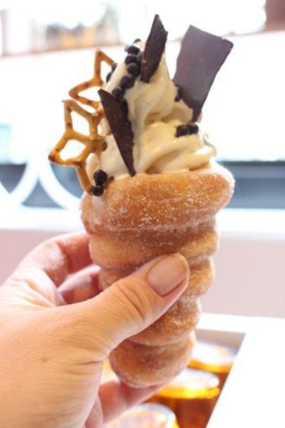 Zumbo's salted caramel soft-serve in a doughnut cone,  garnished with pretzels and chocolate. 