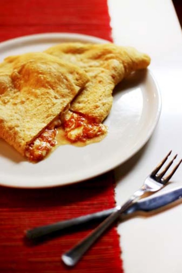 Something for everyone: Ricotta, ham and tomato calzone.