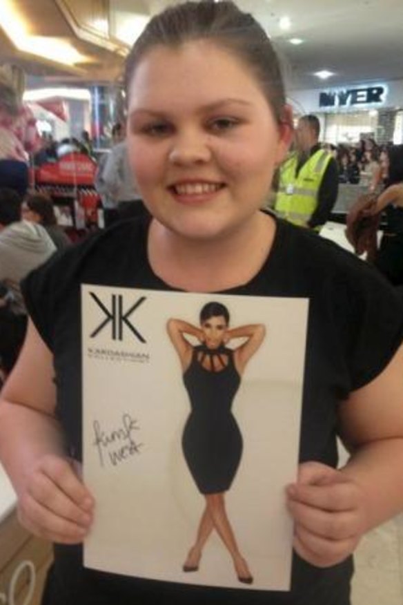 Georgia Mills, 15, scores an autographed picture.