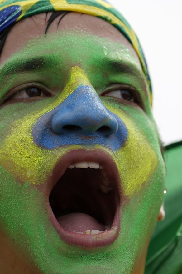 A protester in Rio chants anti-government slogans.