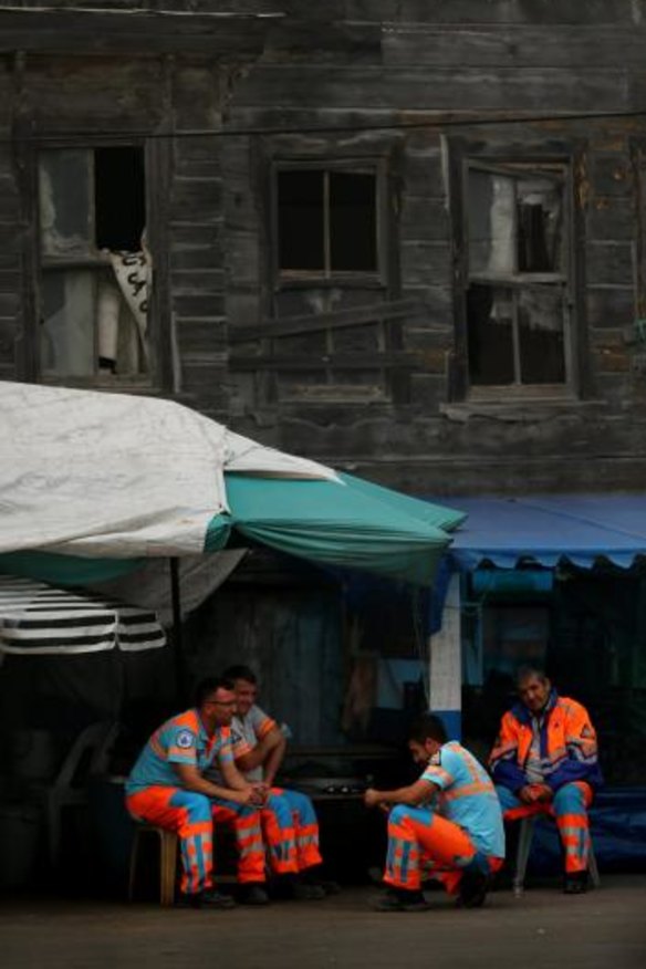 Council workers take a break in the sleepy fishing village of Garipce, Istanbul.