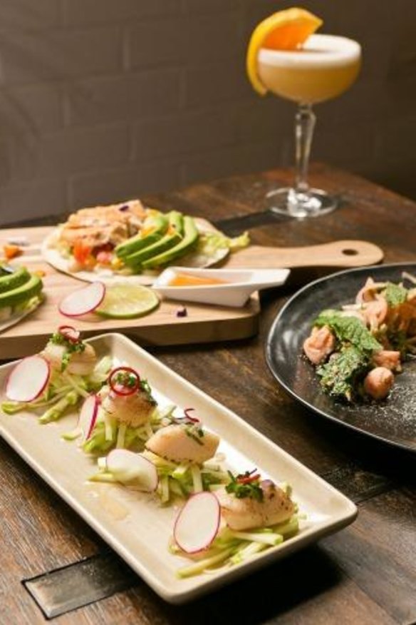 Sous vide Hokkaido scallops with spicy apple salsa (front); peri peri chicken tacos (left); spaghetti namtok salmon (right) with the sakuia cocktail.