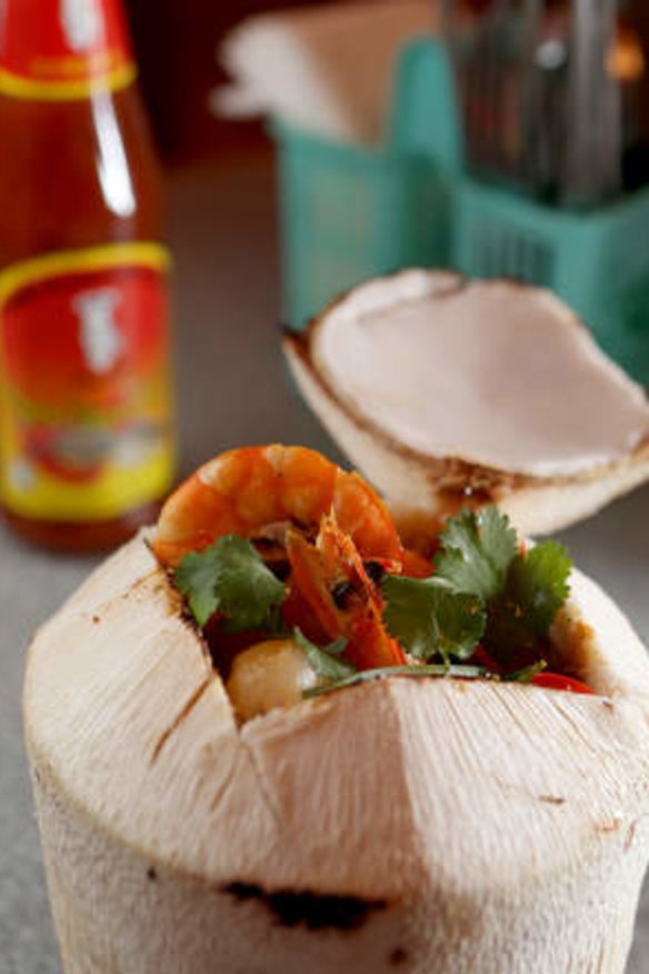 Prawn curry served in a coconut shell.