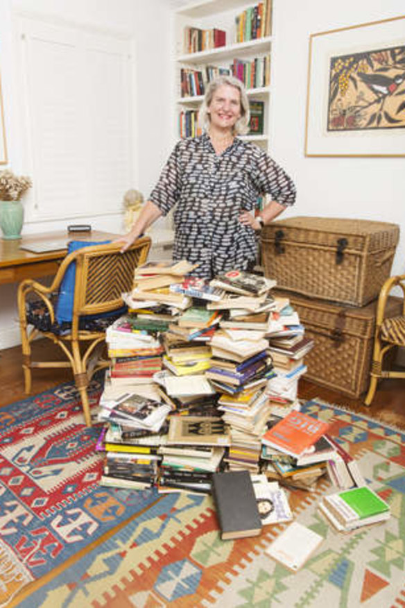 Novel outcome: the author with a pile of her books deemed excess to requirements.