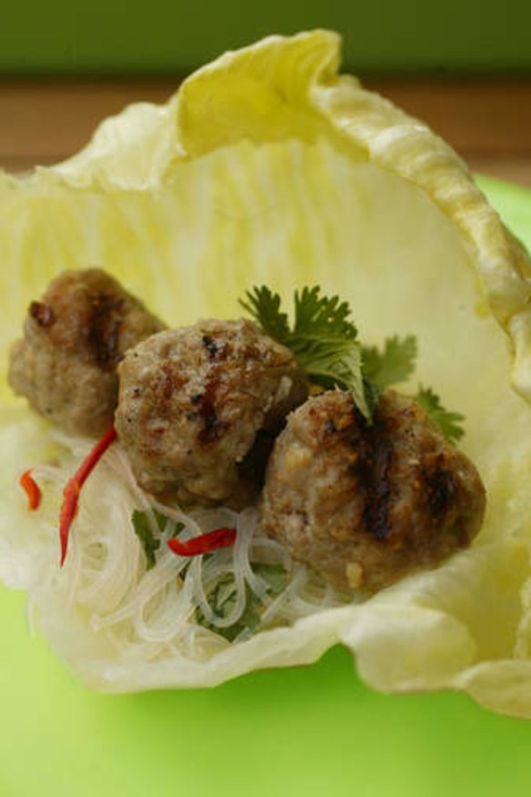 Pork balls with coriander and lettuce.