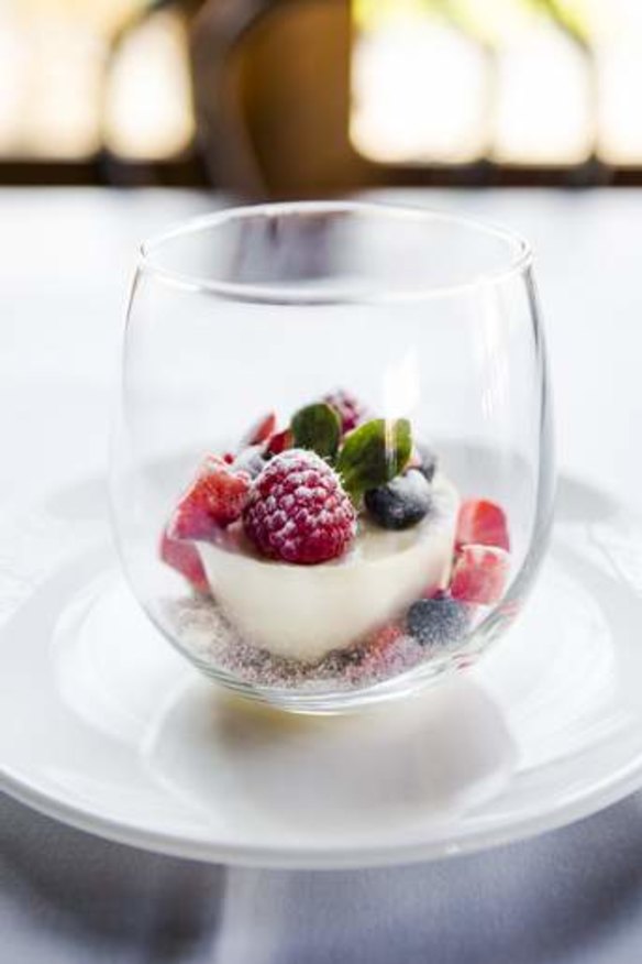 Cheesecake with berries and granola crumble.