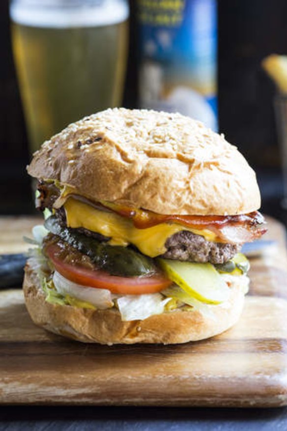 Beef burger with cheese, bacon and caramelised onions.