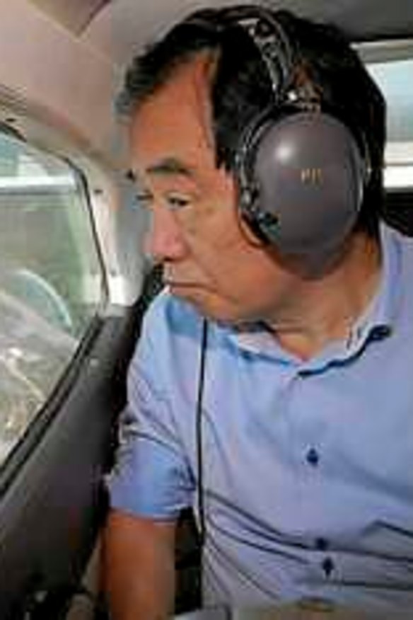 Former Japanese Prime Minister Naoto Kan surveys the mine.