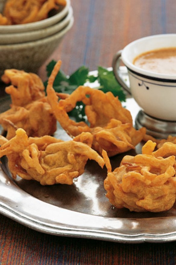 Onion bhajis with curry dip.