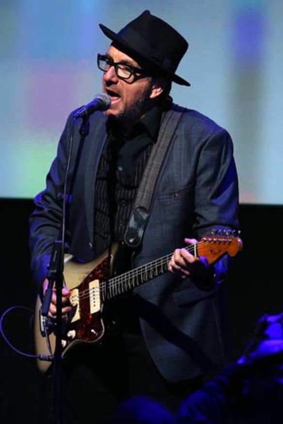 Elvis Costello performs at the Apple event.
