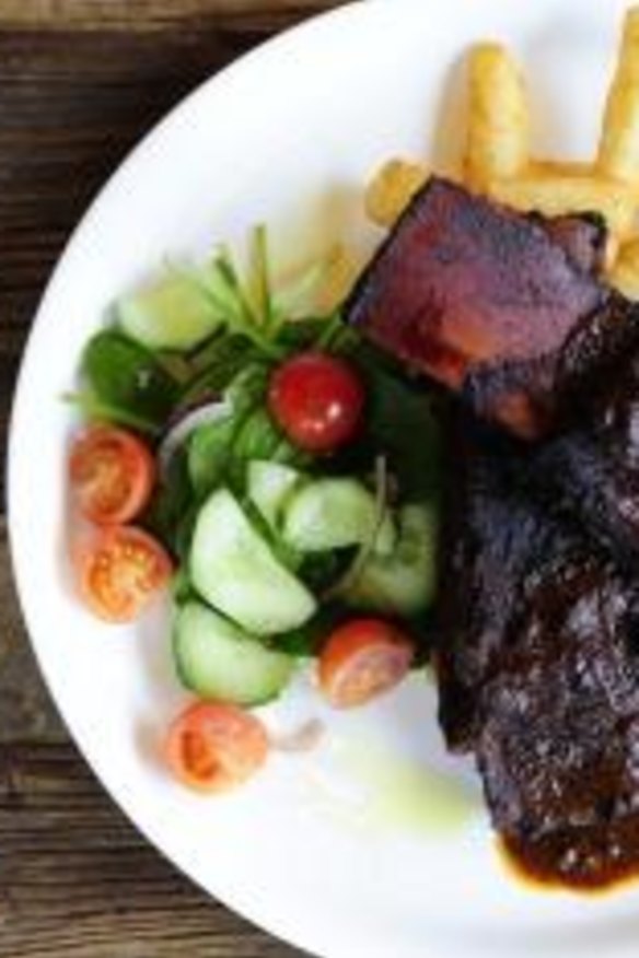 Six-hour braised beef short ribs served with house garden salad and thick cut chips.