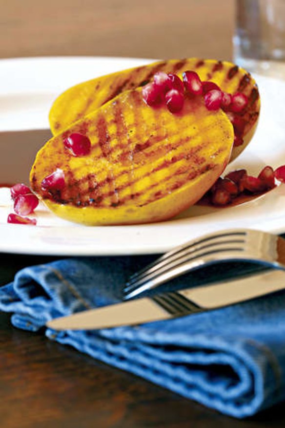 Barbecued mango cheeks with pomegranate.