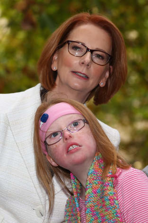 Former prime minister Julia Gillard meets Sophie Dean from the disabled community in May.