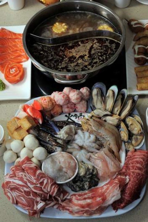 The Hot Pot Gungahlin. A seafood and meat platter with the hot pot containing two different stocks.