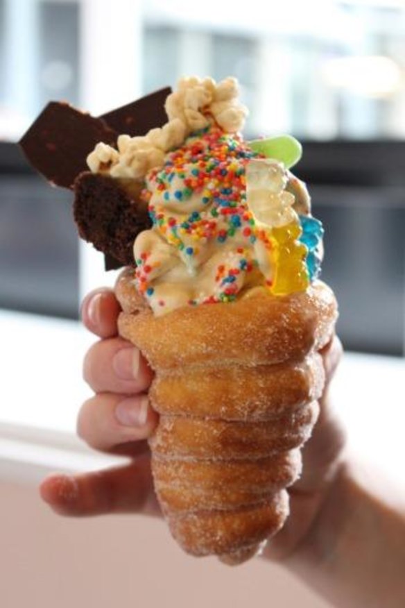 Adriano Zumbo's V8 Vanilla soft serve with Gummi Bears, popcorn and hundreds and thousands in a doughnut cone.