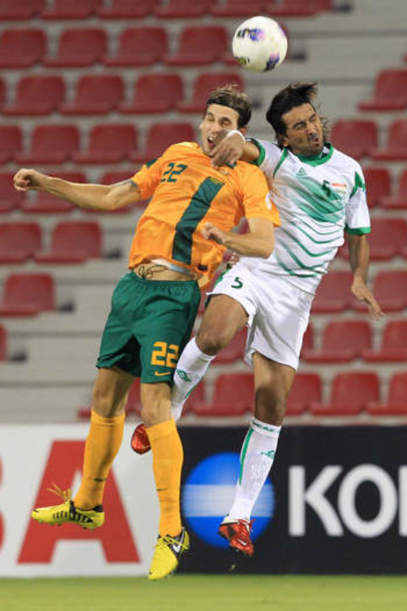 Matthew Spiranovic of Australia competes with Nashat Akram of Iraq in Doha last year.