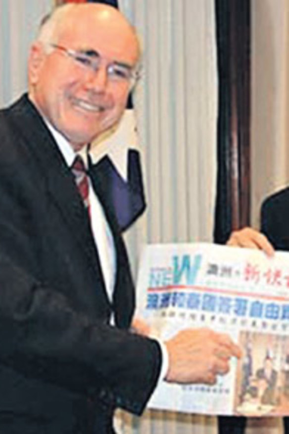A well-connected man . . . Dr Chau Chak Wing with the former prime minister, John Howard. Dr Chau is welcomed by both sides of politics.