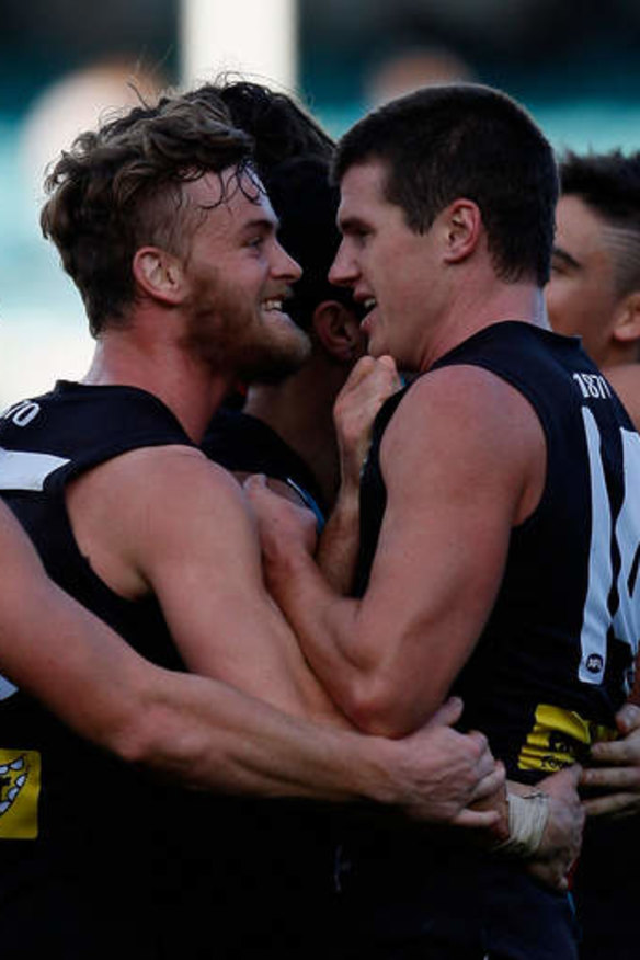 John McCarthy (left) celebrates with teammates last year.
