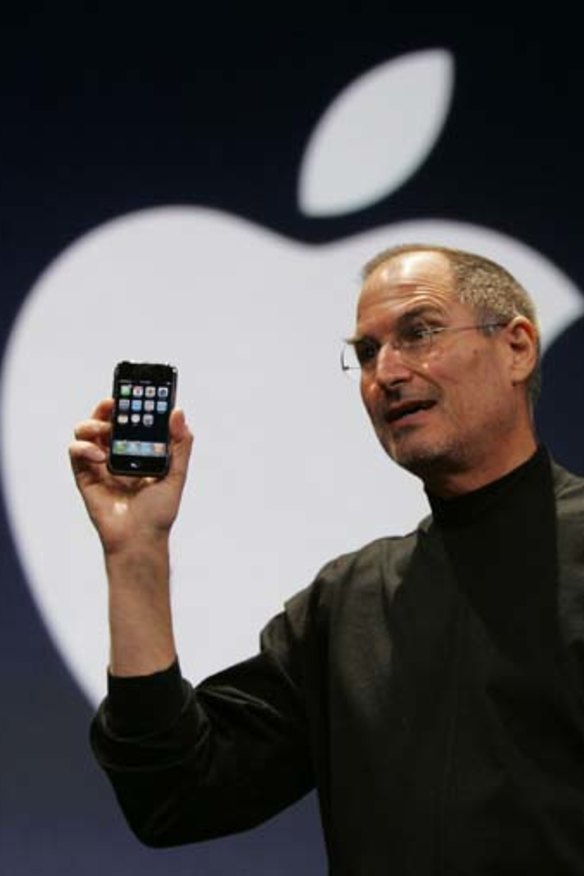 Steve Jobs holds up the first iPhone during his keynote address at MacWorld Conference & Expo in San Francisco in 2007.