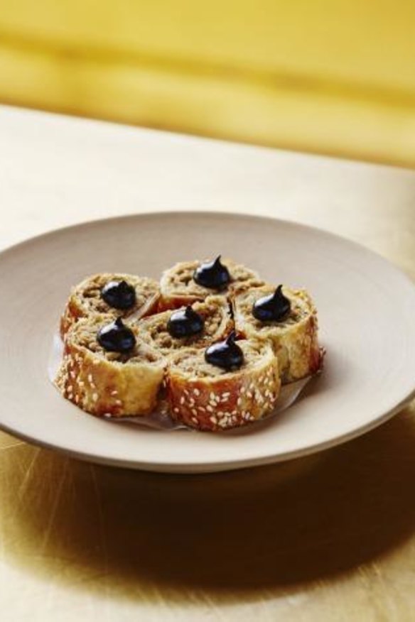 Suckling-pig sausage rolls with black garlic at Bennelong.