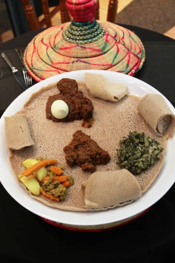 Tasty ... Jambo Jambo platter with, Doro Wot (chicken), Key Wot (beef, hot), Alicha Wot (beef mild) and Gomen (collard greens) served with injera (bread).
