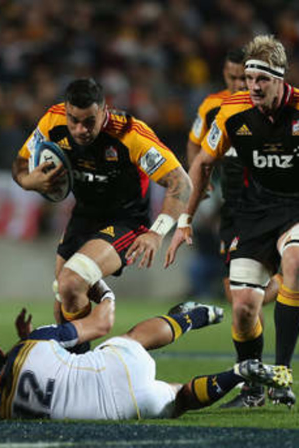 Coming through: Liam Messam of the Chiefs charges with the ball against the Brumbies in the Super Rugby final.
