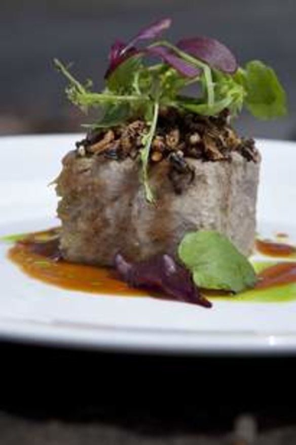 Confit duck terrine with a cointreau and burnt orange dressing, mustard cress and puffed wild rice.