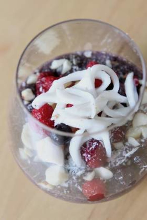 Pete Evans's healthy chia seed pudding with mixed berry puree and fresh berries, nuts and coconut.