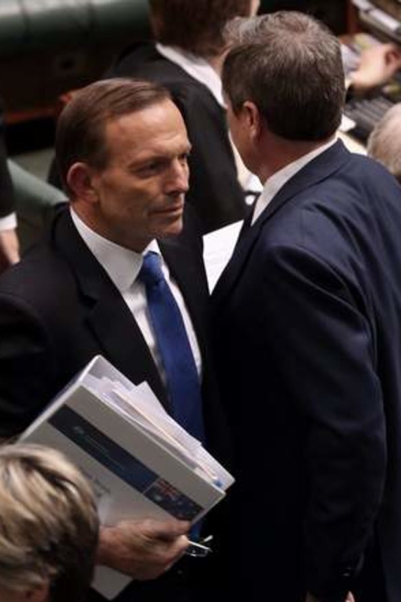 Prime Minister Tony Abbott and Opposition Leader Bill Shorten pass after a division in Parliament House. Photo: Andrew Meares