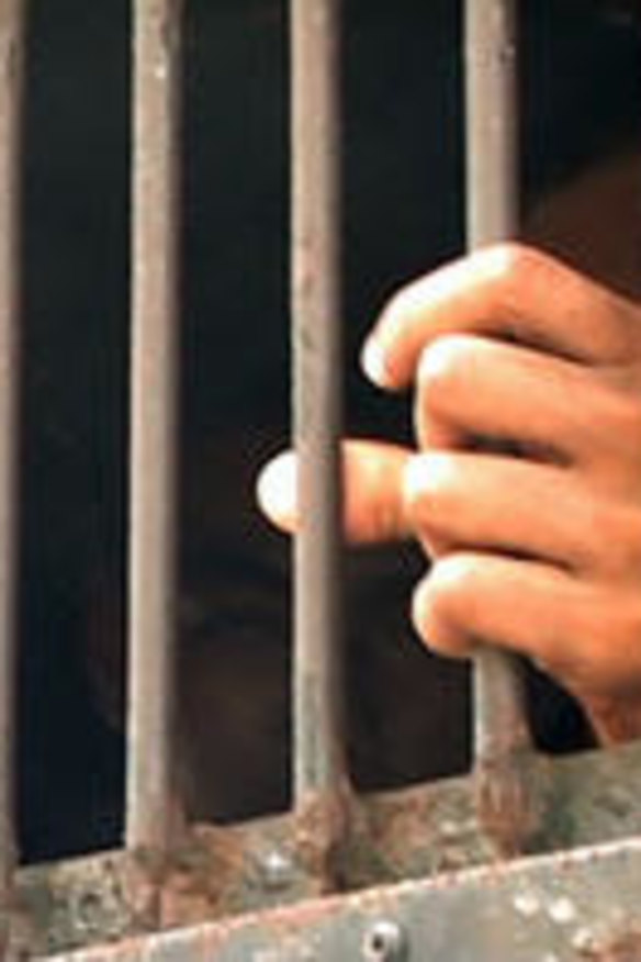 A still from the film <i>Dancing with Dictators</i> shows him in custody.