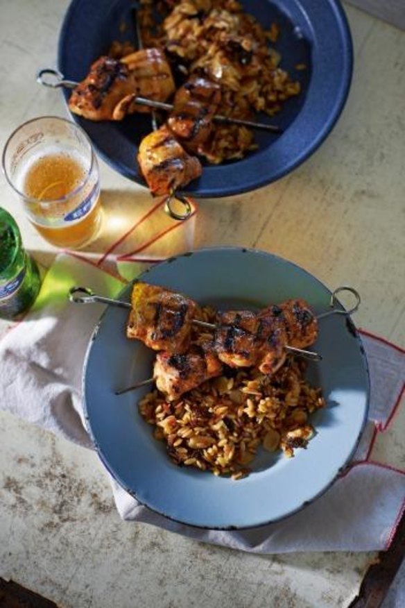 Chicken kebabs with prune orzo pilaf.
