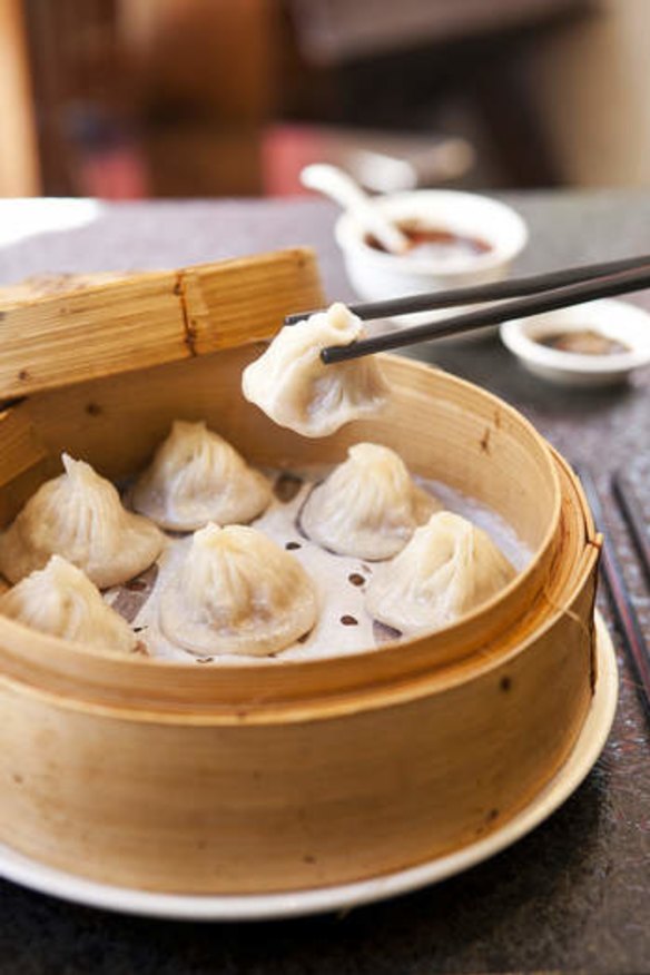 Slurp out the soup first in the xiao long bao at HuTong.