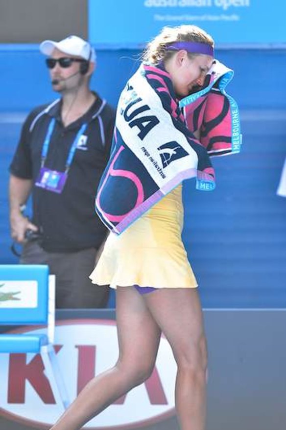 Victoria Azarenka leaves the court for treatment.