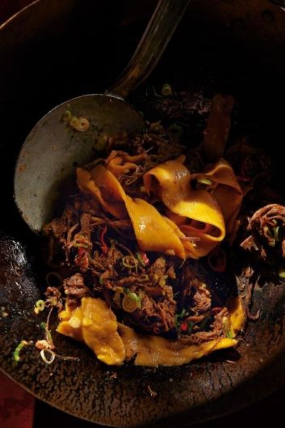Yellow noodles with red-braised brisket.