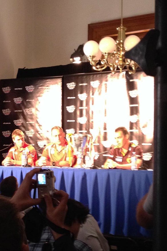 Captain and coaches of the combatants face the media after the grand final parade.