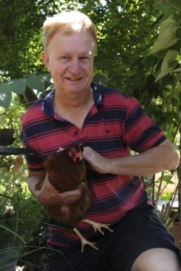 Greg Blood, of Florey, with one of his backyard chooks.