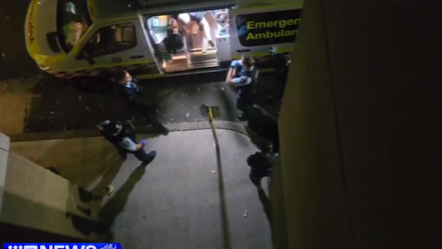 Video shows a distressed Collin Burling asking police to move away from the ambulance so that he can exit the vehicle. A second clip shows Burling on the ground with four officers on top of him, telling him to stop resisting. This video has been edited for length and sensitivity.
