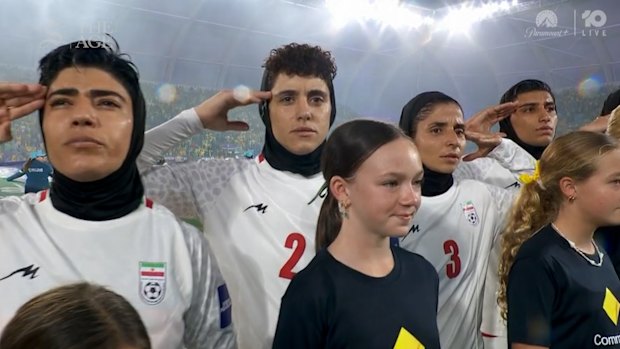 Iran's players were silent before their first match, but saluted the national anthem ahead of the second game against Australia.