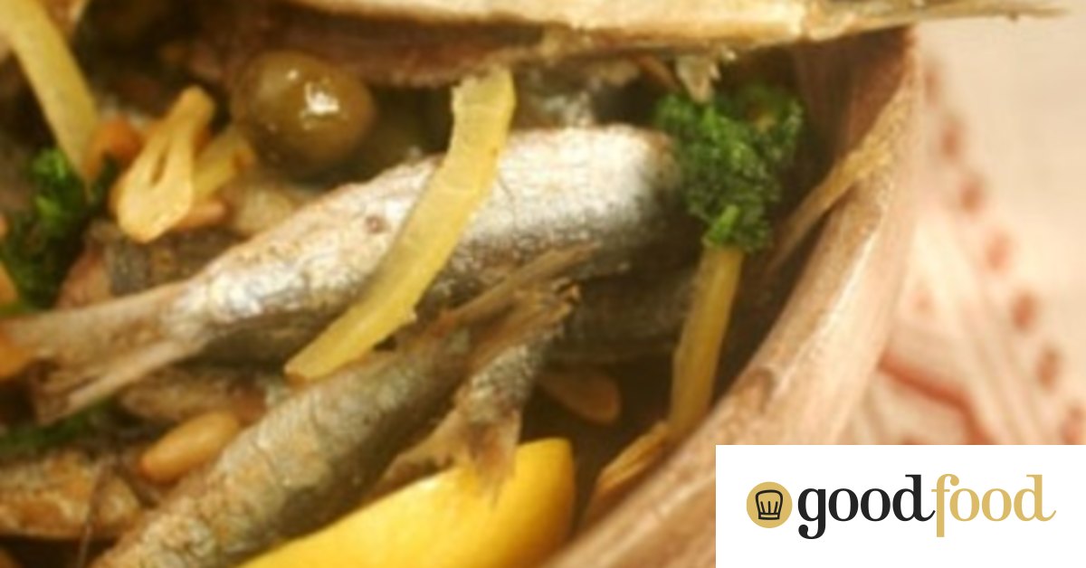 Fried whole sardines with olives, pine nuts and parsley