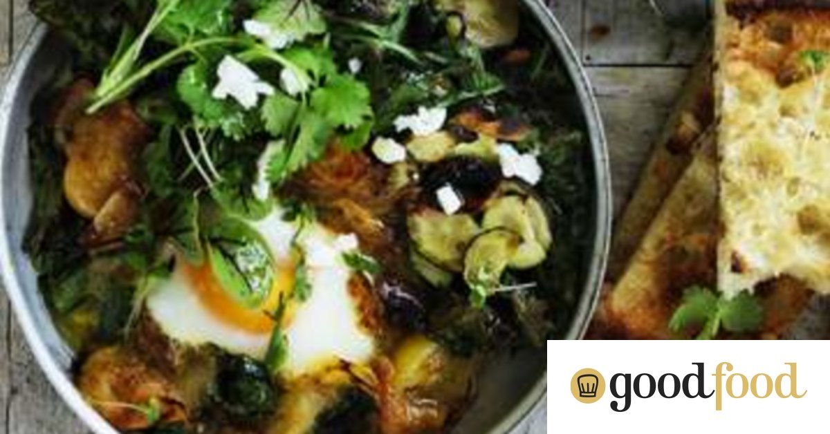 Green shakshuka with hummus